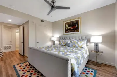 a bedroom with a bed and a ceiling fan at 4 SantaMonica De Lux in Los Angeles