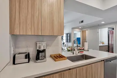 a kitchen with a sink and a coffee maker at 4 SantaMonica De Lux in Los Angeles