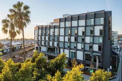 an office building in the city with a train at The Shay, a Destination by Hyatt in Los Angeles