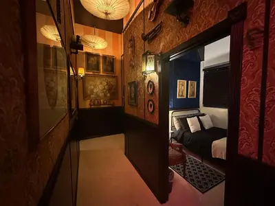 a room with a bedroom with a bed and a hallway at The Rosemary in Los Angeles