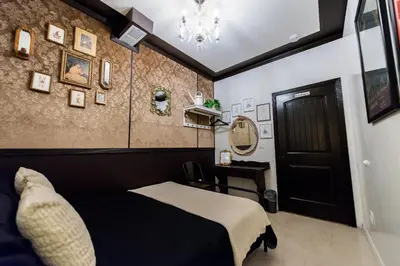 a bedroom with a black bed and a black door at The Rosemary in Los Angeles