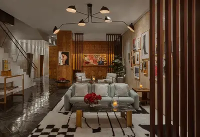 a living room with a couch and a table at SIXTY Beverly Hills in Los Angeles