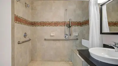 a bathroom with a shower and a sink at Studio 6 Ontario CA Convention Center Airport in Ontario
