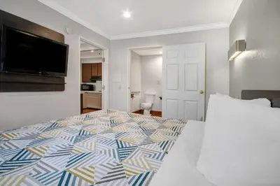 a bedroom with a bed and a flat screen tv at Studio 6 Ontario CA Convention Center Airport in Ontario