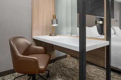 a desk and a chair in a hotel room at SpringHill Suites by Marriott Riverside Redlands in Redlands