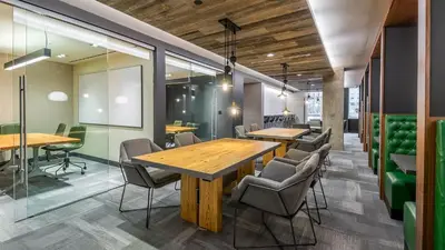 a conference room with wooden tables and chairs at Apart Hotel near Dodgers Stadium in Los Angeles