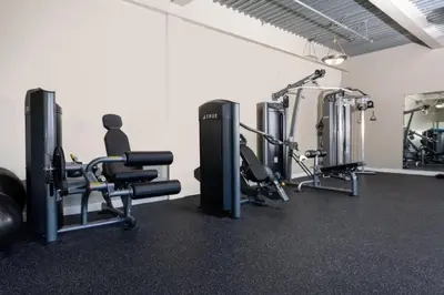 a gym with several treadmills and cardio machines at Huge Downtown LA Loft with Rooftop Pool & Jacuzzi in Los Angeles