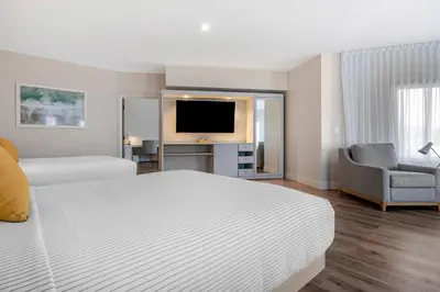 a hotel room with a bed and a television at Cambria Hotel Calabasas - Malibu in Calabasas
