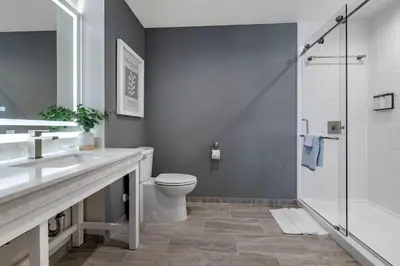 a bathroom with a toilet and a sink and a shower at Cambria Hotel Calabasas - Malibu in Calabasas