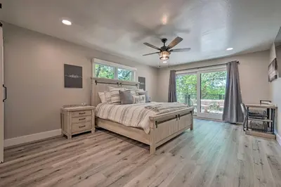 a bedroom with a bed and a ceiling fan at Airy Alpine Getaway with Lake Arrowhead Views! in Lake Arrowhead