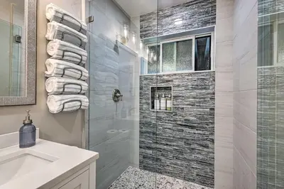 a bathroom with a shower and a sink at Airy Alpine Getaway with Lake Arrowhead Views! in Lake Arrowhead