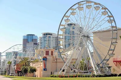 a large ferris wheel in front of a city at Blanquitas Home in Long Beach