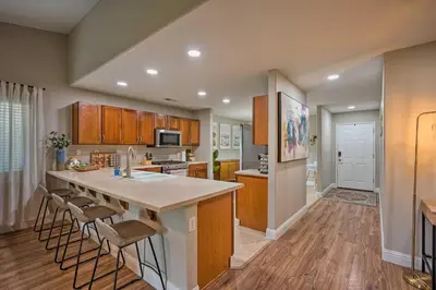 a kitchen with a large island in the middle of a room at Family-Friendly Home, 6 Mi to Riverwalk Plaza in Bakersfield