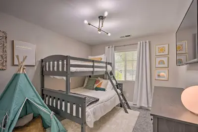 a bedroom with two bunk beds and a desk at Family-Friendly Home, 6 Mi to Riverwalk Plaza in Bakersfield