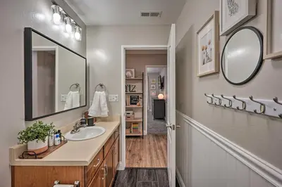 a bathroom with a sink and a mirror at Family-Friendly Home, 6 Mi to Riverwalk Plaza in Bakersfield
