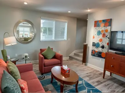 a living room with a couch and a tv at Hollywood Homes Free parking close to all things LA in Los Angeles
