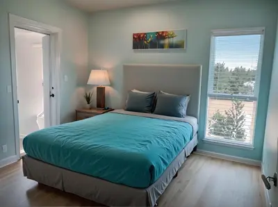 a bedroom with a bed with blue sheets and a window at Hollywood Homes Free parking close to all things LA in Los Angeles