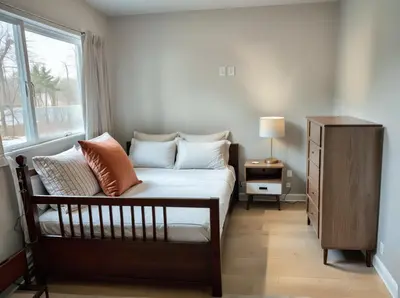 a bedroom with a bed with pillows and a window at Hollywood Homes Free parking close to all things LA in Los Angeles