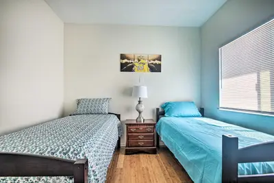 a bedroom with two beds next to a window at 5 Mi to Universal Studios Family Gem with Hot Tub! in Burbank