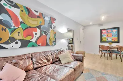 a living room with a couch and a painting on the wall at 10 Cozy apartment heart of Santa Monica in Los Angeles