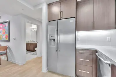 a kitchen with a stainless steel refrigerator and a bathroom at 10 Cozy apartment heart of Santa Monica in Los Angeles