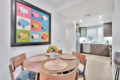 a kitchen and dining room with a table and chairs at 10 Cozy apartment heart of Santa Monica in Los Angeles