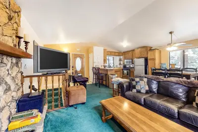 a living room with a couch and a tv at Morrison Manor in Lake Arrowhead