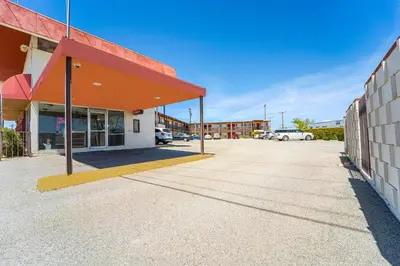 an empty parking lot in front of a building at Mojave Hotel in Mojave