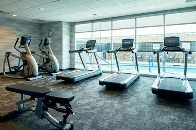a gym with cardio machines and a large window at Fairfield by Marriott Inn & Suites Palmdale West in Palmdale
