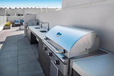 a kitchen with a sink and a counter in a room at Sky-Rise Apartments in Los Angeles