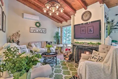 a living room filled with furniture and a fireplace at 1 Mi to Lake Gregory Boho Crestline Cabin in Crestline