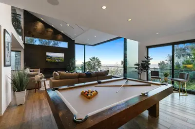 a large living room with a pool table at Franklin Modern in Los Angeles