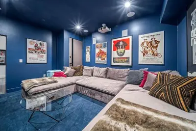 a living room with a large couch and blue walls at Willow Glen in Los Angeles