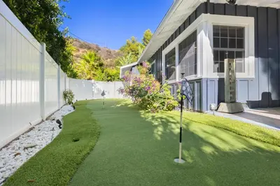 a golf course in front of a house at Hidden Valley PL in Los Angeles