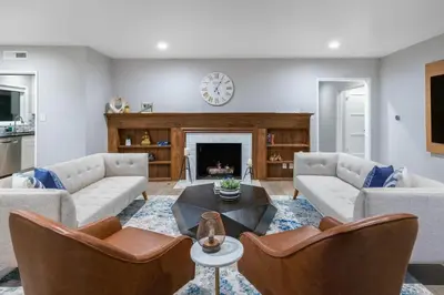 a living room with two couches and a fireplace at Hidden Valley PL in Los Angeles