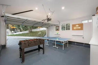 a ping pong table in a garage with a ping pong ball at Hidden Valley PL in Los Angeles