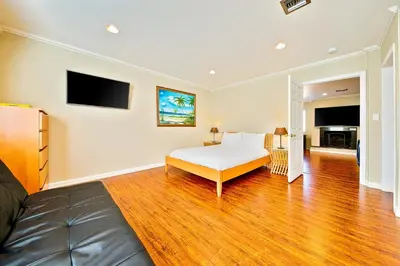 a bedroom with a bed and a living room at Disney Getaway in Anaheim