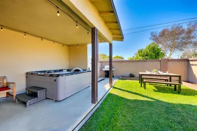 a backyard with a grill and a picnic table at Disney Getaway in Anaheim