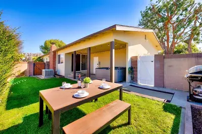 a table and a bench in the backyard of a house at Disney Getaway in Anaheim