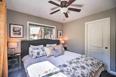 a bedroom with a bed with a ceiling fan at Tree-Lined Twin Peaks Cottage with Custom Stream in Twin Peaks