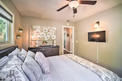 a bedroom with a bed and a ceiling fan at Tree-Lined Twin Peaks Cottage with Custom Stream in Twin Peaks