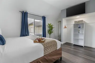 a bedroom with a bed and a large window at Best Western Westminster Inn in Westminster