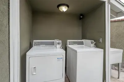 two washing machines sitting next to each other in a room at Best Western Westminster Inn in Westminster