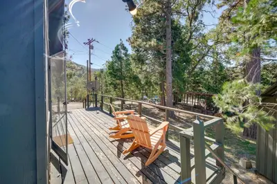 a deck with three wooden chairs sitting on it at Quiet Sequoia National Forest Cabin with Fireplace in Posey