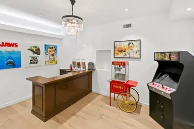 a room with a video game arcade and a game console at Beverly Hills Maison in Beverly Hills