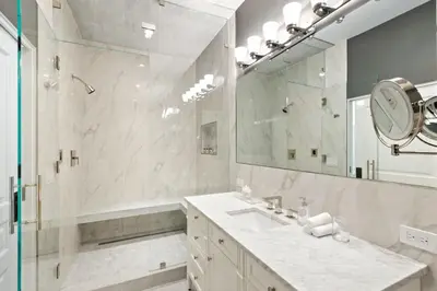 a bathroom with a sink and a shower and a mirror at Beverly Hills Maison in Beverly Hills