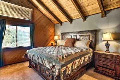 a bedroom with a large bed and a window at Tranquil Twin Peaks Retreat Hike, Ski and Swim in Twin Peaks