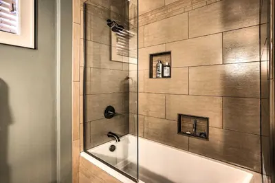 a bathroom with a shower and a tub and a sink at Tranquil Twin Peaks Retreat Hike, Ski and Swim in Twin Peaks