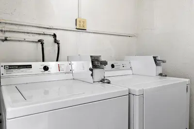 two white washers sitting next to each other in a room at Royal Palace Westwood Hotel in Los Angeles