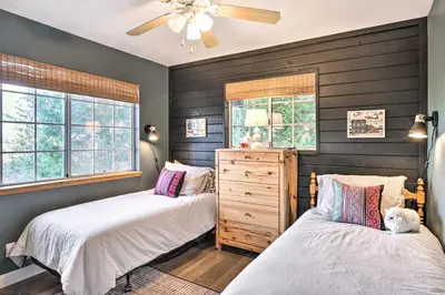 a bedroom with two beds and a ceiling fan at Luxe Lake Arrowhead Getaway with Treetop Views! in Lake Arrowhead